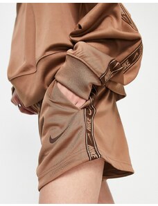 Nike swoosh tape shorts in archaeo brown