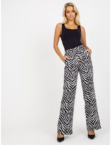Fashionhunters Black and white wide trousers made of animal print fabric