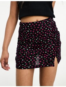 Only notch front mini skirt in black and red ditsy floral