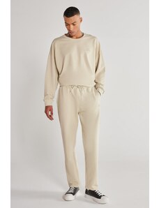 AC&Co / Altınyıldız Classics Unisex Beige Standard Fit Normal Cut, Flexible Cotton Sweatpants with Pockets.
