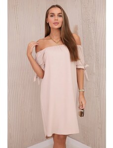 Kesi Dress with a longer back and ties on the sleeves in beige color