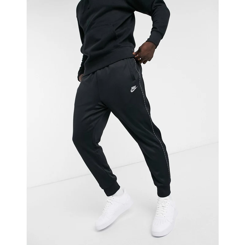 Nike Repeat Pack logo taping polyknit cuffed joggers in black GLAMI.hu